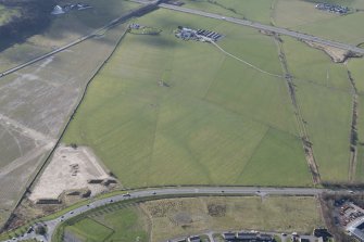 Oblique aerial view of the site of the Raploch aerodrome, looking SW.