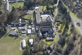 Oblique aerial view of Queen Victoria School, looking SW.