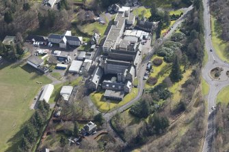 Oblique aerial view of Queen Victoria School, looking SE.