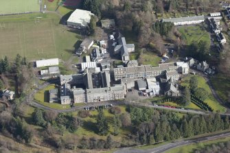 Oblique aerial view of Queen Victoria School, looking ENE.