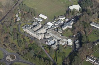 Oblique aerial view of Queen Victoria School, looking NNE.