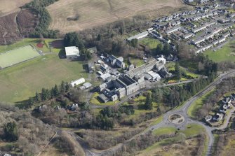 Oblique aerial view of Queen Victoria School, looking E.