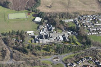 Oblique aerial view of Queen Victoria School, looking ENE.