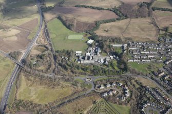 Oblique aerial view of Queen Victoria School, looking NE.