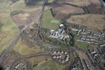 Oblique aerial view of Queen Victoria School, looking NE.