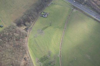 Oblique aerial view of the site of practice trenches, looking SE.