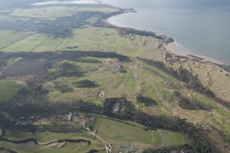 General oblique aerial view of Muirfield Golf Course with Gullane Bay beyond, looking WSW.