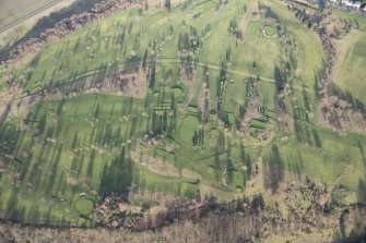 Oblique aerial view of the golf course and the disused race course, looking NW.