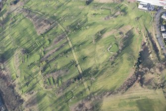 Oblique aerial view of the dam, the farmstead and the disused race course, looking N.