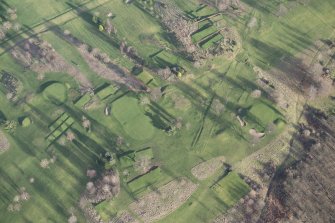 Oblique aerial view centred on part of the disused race course, the farmstead and the golf course, looking ESE.