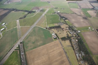 General oblique aerial view of the airfield technical site and former hospital, looking WSW.