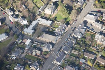 Oblique aerial view of Tayport Cinema, Drill Hall and Episcopal Church, looking N.