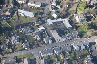 Oblique aerial view of Tayport Cinema, Drill Hall and Episcopal Church, looking NW.