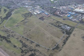 Oblique aerial view of Montrose Airfield, looking W.