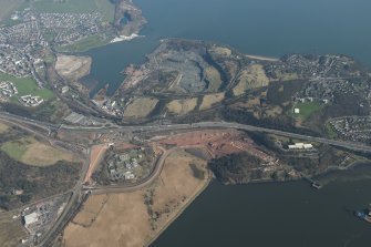 Oblique aerial view of the Queensferry Crossing construction, Inverkeithing Bay and Cruiks Quarry, looking to the ENE.
