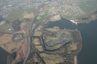Oblique aerial view of the Queensferry Crossing construction, Inverkeithing Bay and Cruiks Quarry, looking to the ENE.