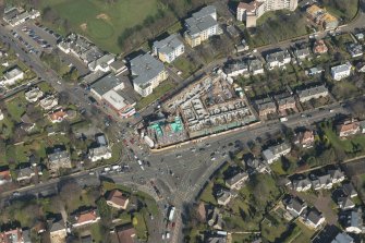 Oblique aerial view of the building site of the former Barnton Hotel, looking to the NNE.