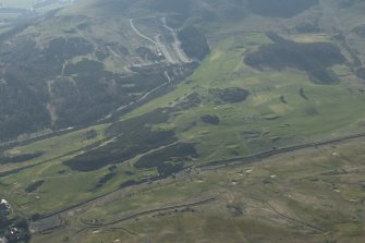 Oblique aerial view of Lothianburn and Swanston Golf Courses and Swanston Village, looking to the SSW.