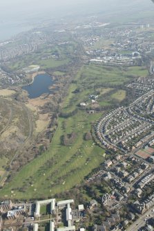 Oblique aerial view of Prestonfield Golf Course and Duddingston Loch, looking to the NNE.