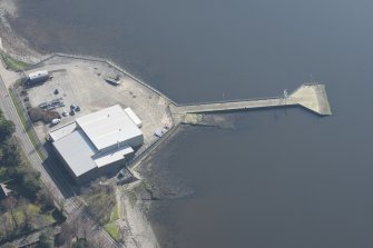 Oblique aerial view of former seaplane base, looking SE.