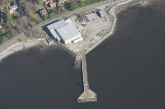 Oblique aerial view of former seaplane base, looking NE.