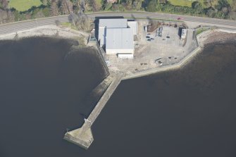 Oblique aerial view of former seaplane base, looking N.