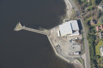 Oblique aerial view of former seaplane base, looking NNW.