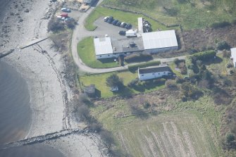 Oblique aerial view of the pillbox and RA store, looking WSW.