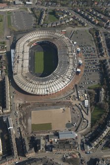 Oblique aerial view of Hampden Park and Lesser Hampden Park  being converted to Commonwealth games venues, looking to the E.