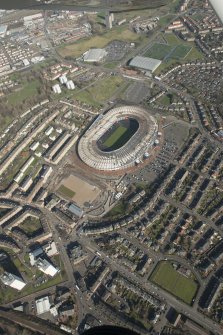 Oblique aerial view of Hampden Park and Lesser Hampden Park  being converted to Commonwealth games venues, looking to the NE.