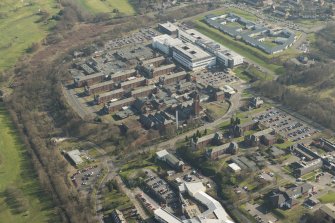 Oblique aerial view of of Stobhill General Hospital, looking to the ESE.