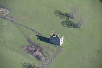 Oblique aerial view of Gilbertfield Castle, looking NE.