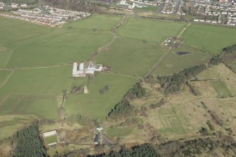 Oblique aerial view of Gilbertfield Castle, looking NNW.