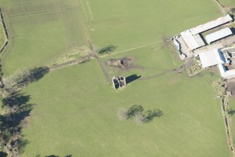 Oblique aerial view of Gilbertfield Castle, looking W.