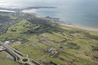 Oblique aerial view of Dundonald Military Camp and Kilmarnock Barassie Golf Course, looking S.