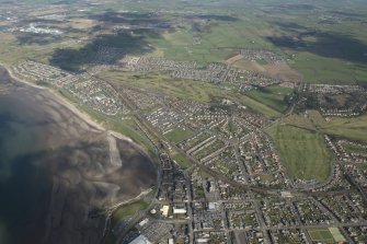 Oblique aerial view of Troon, Marr College, Darley Golf Course and Fullerton Golf Course, looking NE.