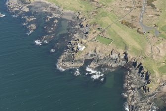 Oblique aerial view of Turnberry Castle and Turnberry Lighthouse, looking ENE.