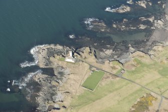 Oblique aerial view of Turnberry Castle and Turnberry Lighthouse, looking NNW.