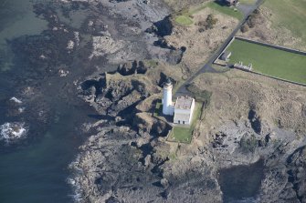 Oblique aerial view of Turnberry Castle and Turnberry Lighthouse, looking SE.