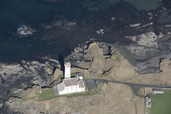 Oblique aerial view of Turnberry Castle and Turnberry Lighthouse, looking N.