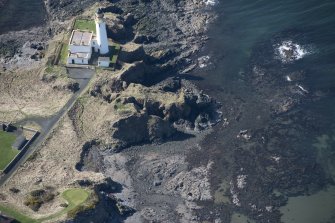 Oblique aerial view of Turnberry Castle and Turnberry Lighthouse, looking ENE.