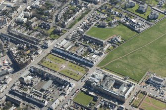 Oblique aerial view of Wellington Square, County Buildings and Prison, looking SE.