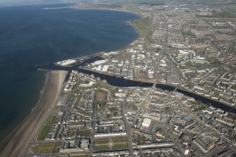 Oblique aerial view of Ayr and main harbour, looking N.