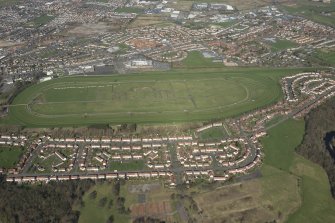 Oblique aerial view of Ayr Airfield and Ayr Racecourse, looking NE.