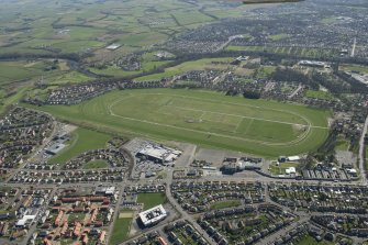 Oblique aerial view of Ayr Airfield and Ayr Racecourse, looking NNW.