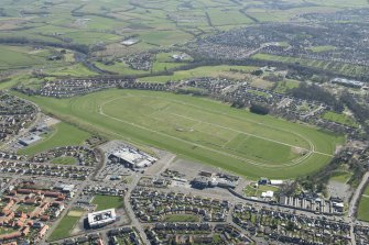 Oblique aerial view of Ayr Airfield and Ayr Racecourse, looking NW.