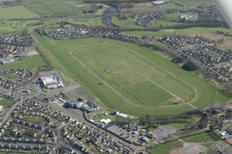 Oblique aerial view of Ayr Airfield and Ayr Racecourse, looking WNW.