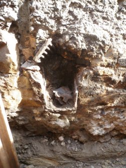 Detail of drain I S facing section of trench 1 cut into the wall