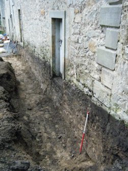 Illustration of View of the trench excavated along the front of the workshop for Historic Building Record and Watching Brief of Hopetoun Home Farm, South Queensferry.