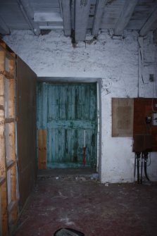 Internal ground floor, Room 2, general view of door on W wall